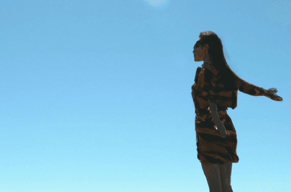 A happy female that has successfully accomplished her goal